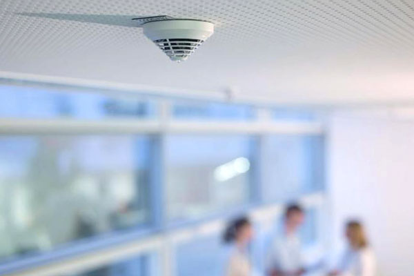 Bosch fire alarm detector installed in the ceiling of an office